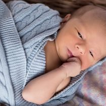 Sleepy baby in blue blanket – Birth, Baby & You – Dee Bell – Lactation Consultant for Kent, Surrey & Sussex